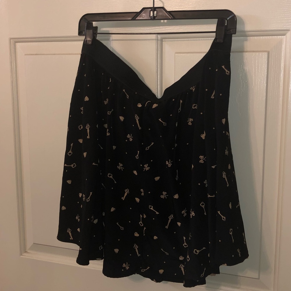 Black skirt with mauve detail print, also has mauve lace underskirt